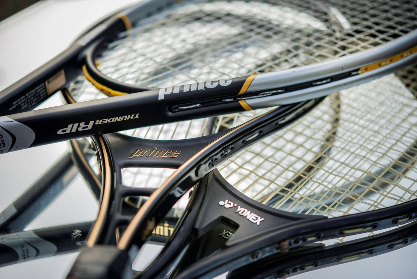 A close-up of tennis racquets.